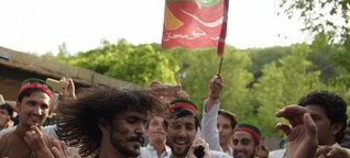 Imran Khan's supporters dance in the street as former cricketer declares victory